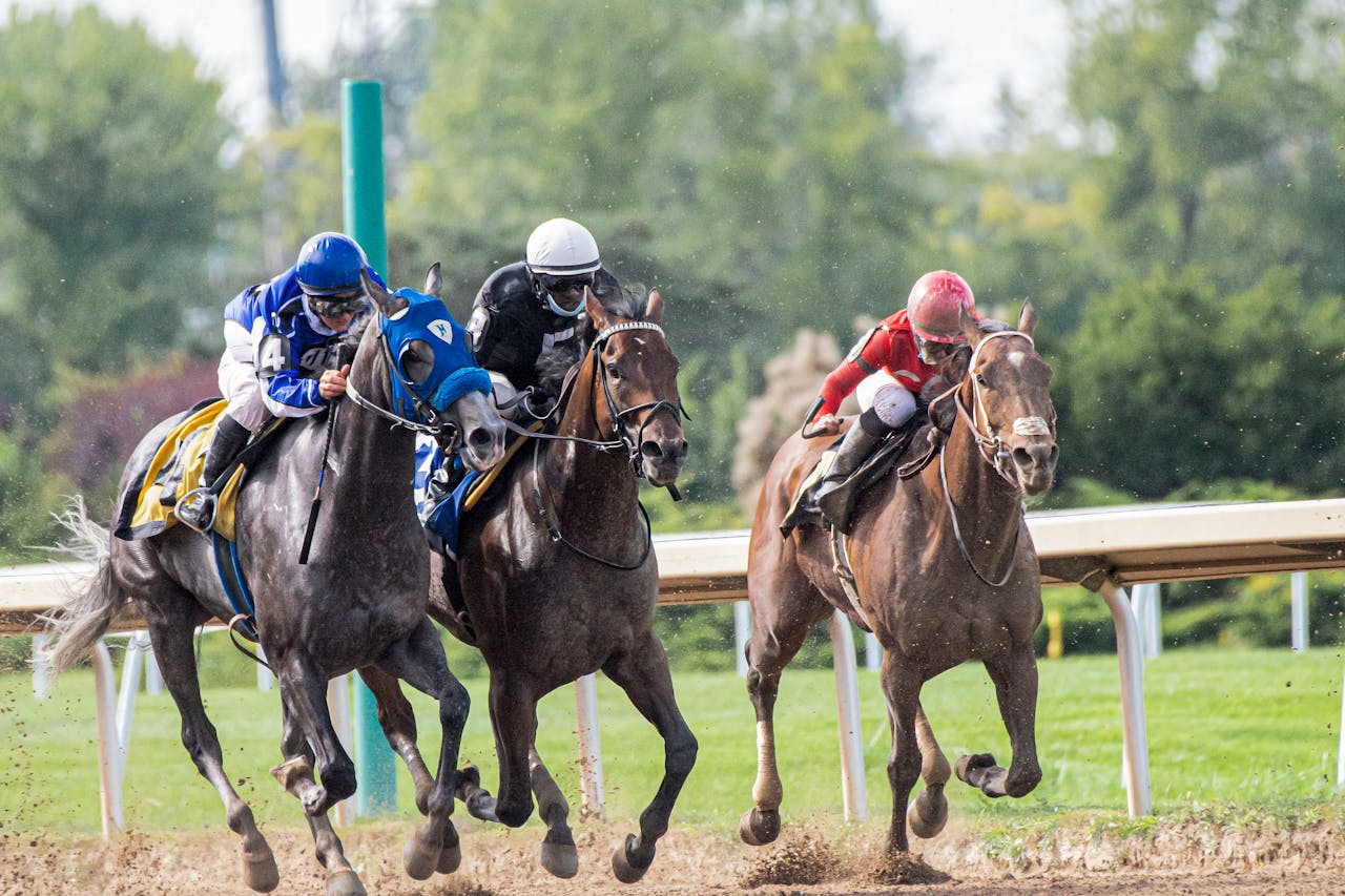 Dynamic capture of a thrilling horse race showcasing three jockeys and racehorses in intense competition.